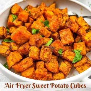 Air fryer sweet potato cubes on a plate.