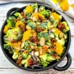 Broccoli Salad with Bacon and Almonds in a black serving dish.