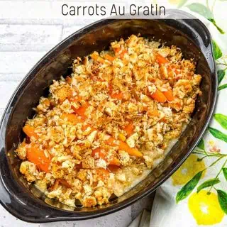 Carrots au Gratin in a black oval serving dish.