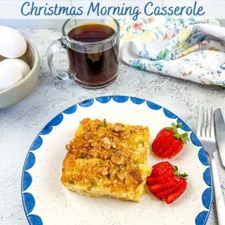 Christmas morning casserole on a plate with berries.