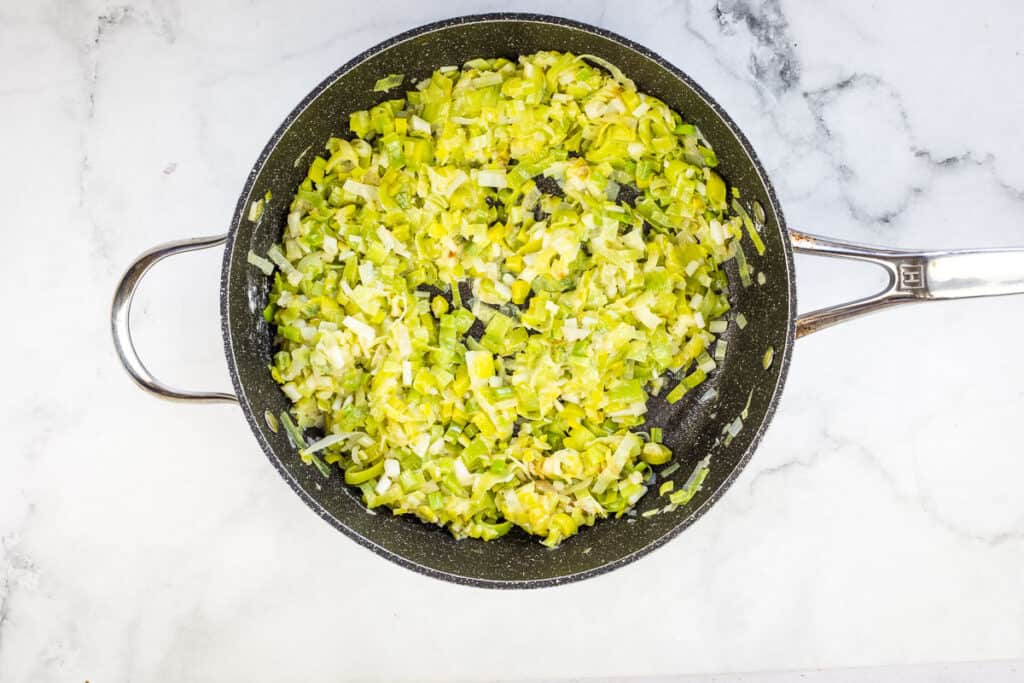 Deglazing the skillet with white wine.
