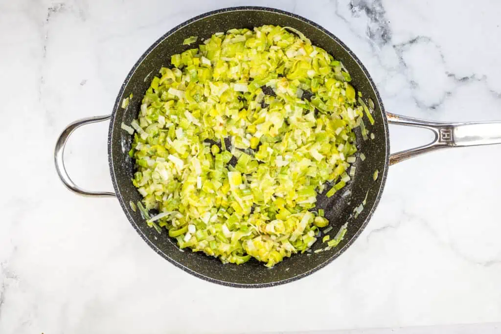 Deglazing the skillet with white wine.