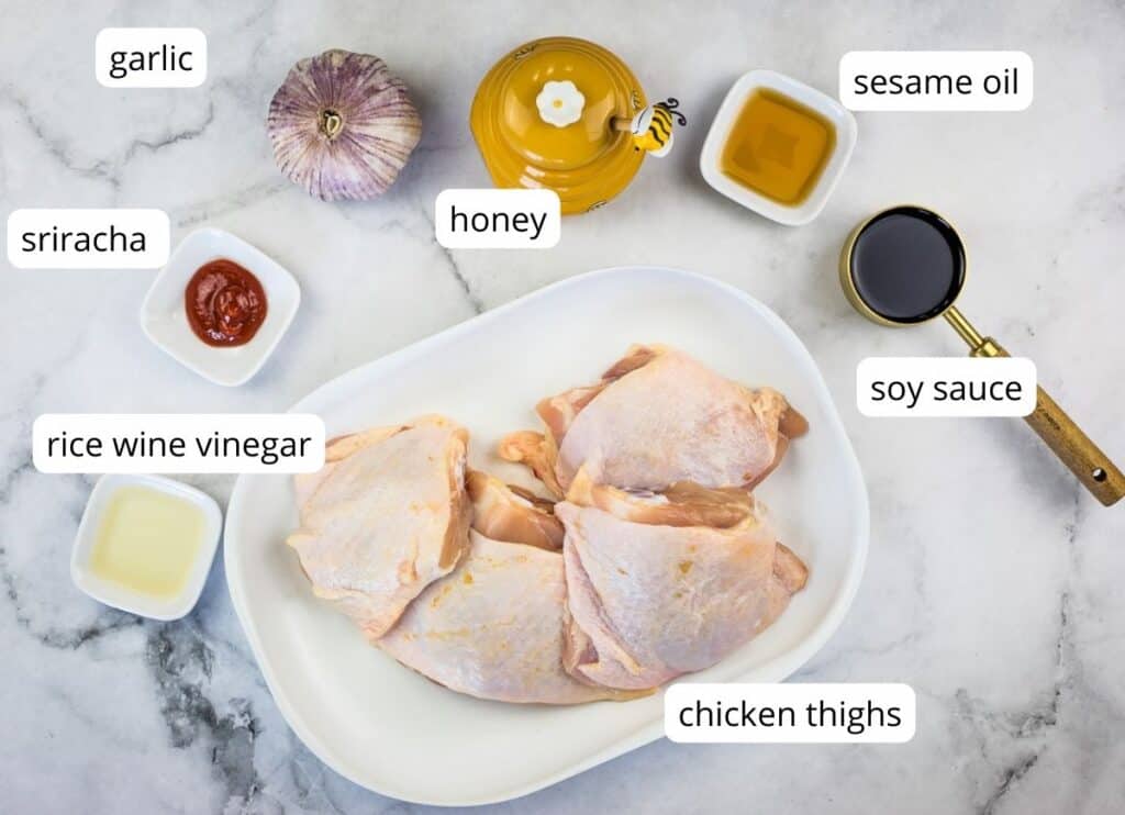 Labeled ingredients to make air fryer honey garlic chicken thighs.