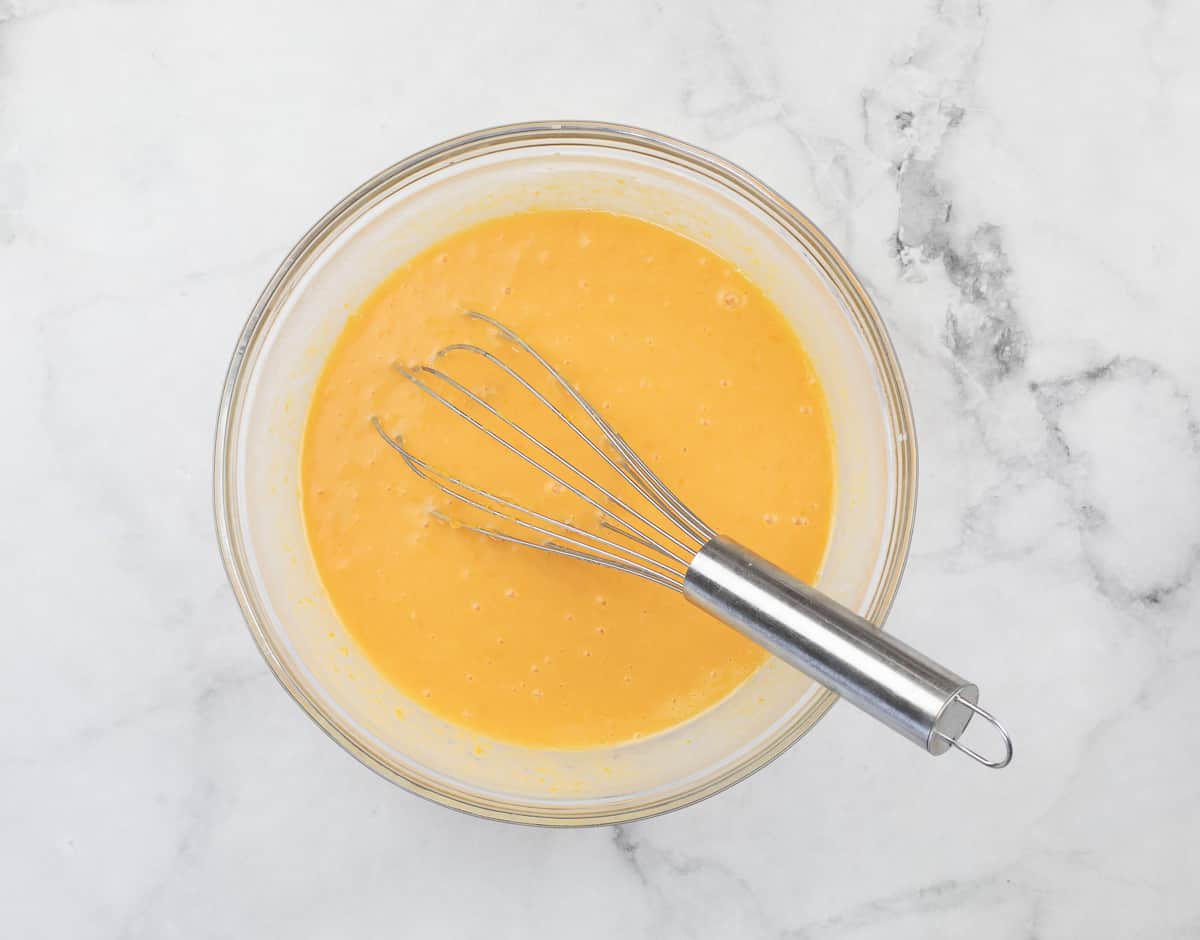 Wet ingredients whisked together in a bowl.