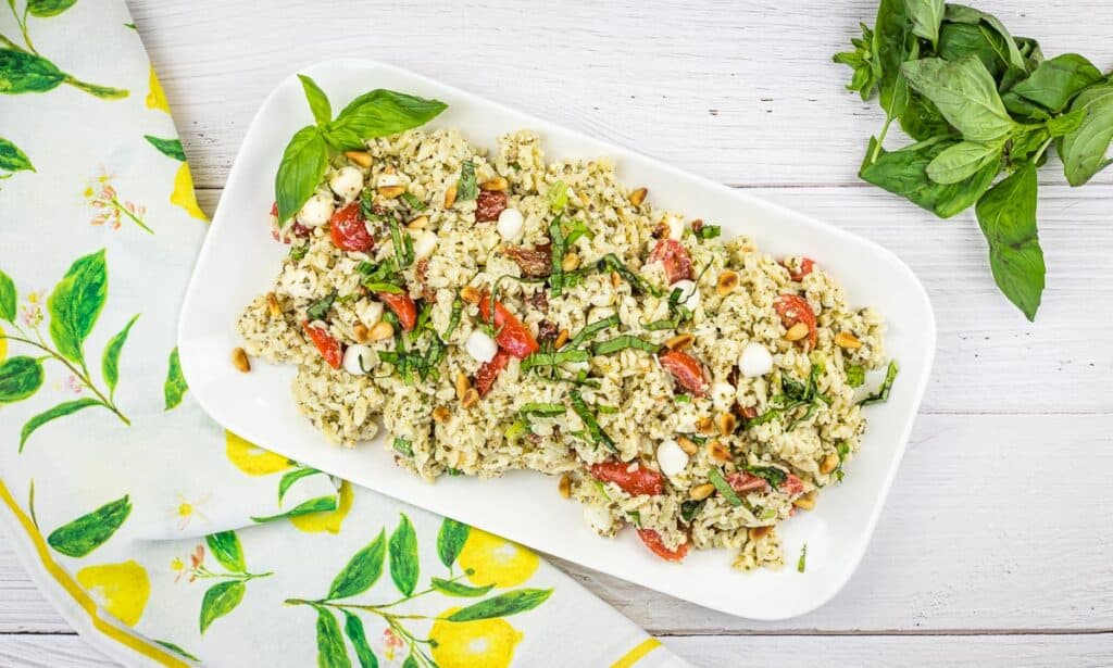 Pesto orzo salad on a white plate.