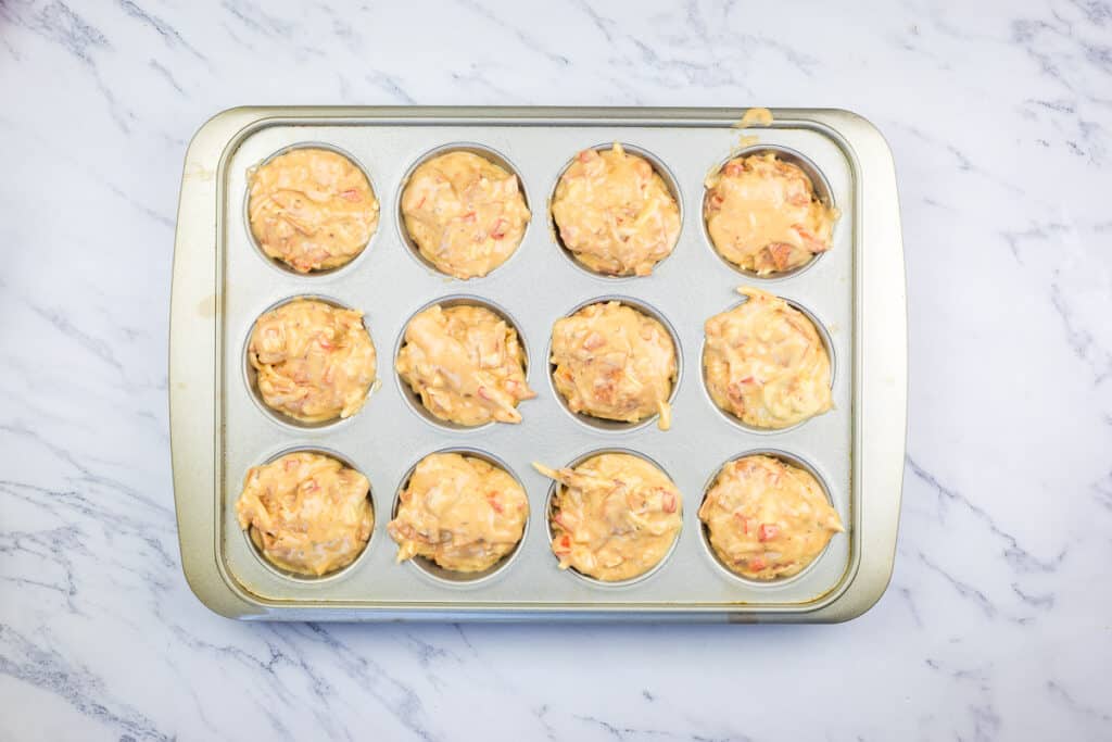 Filled muffin pan ready for the oven.