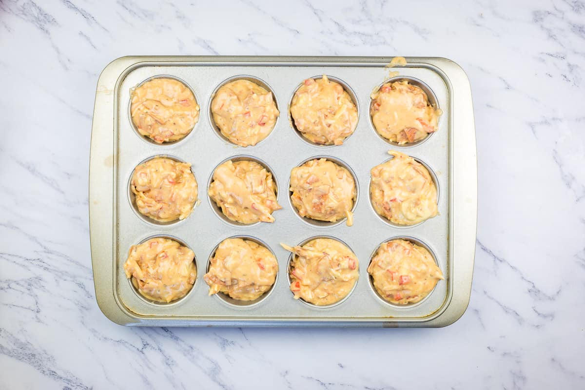 Filled muffin pan ready for the oven.