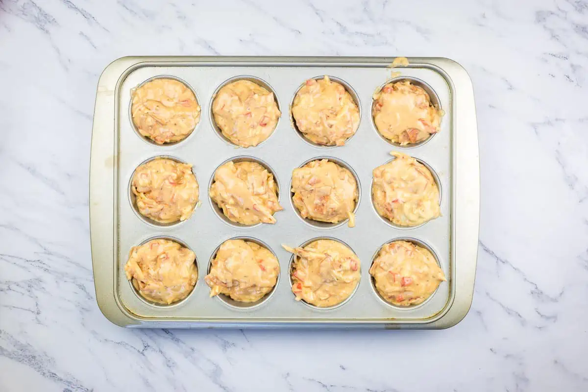 Filled muffin pan ready for the oven.