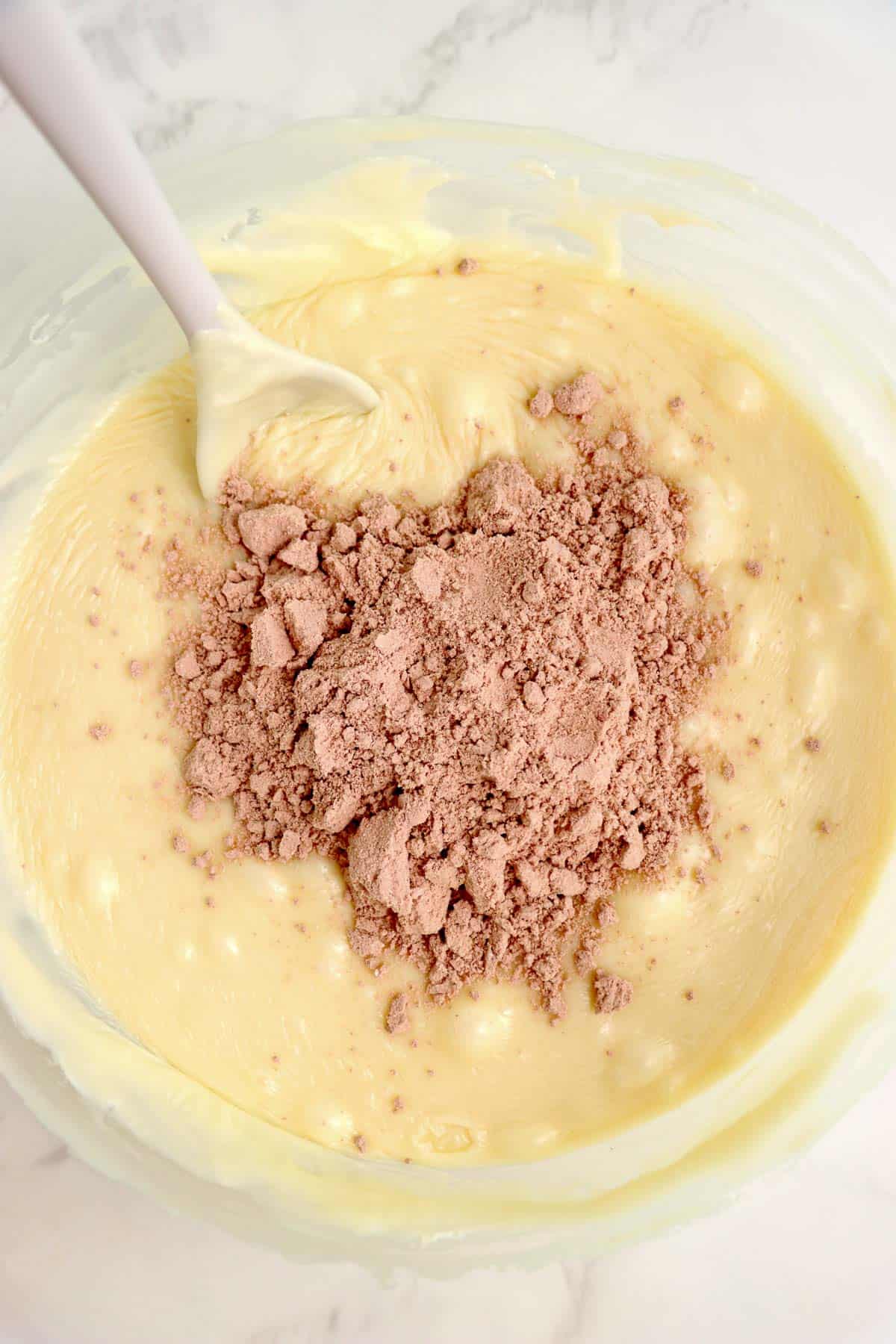 Red velvet cake mix added to melted chocolate mixture.