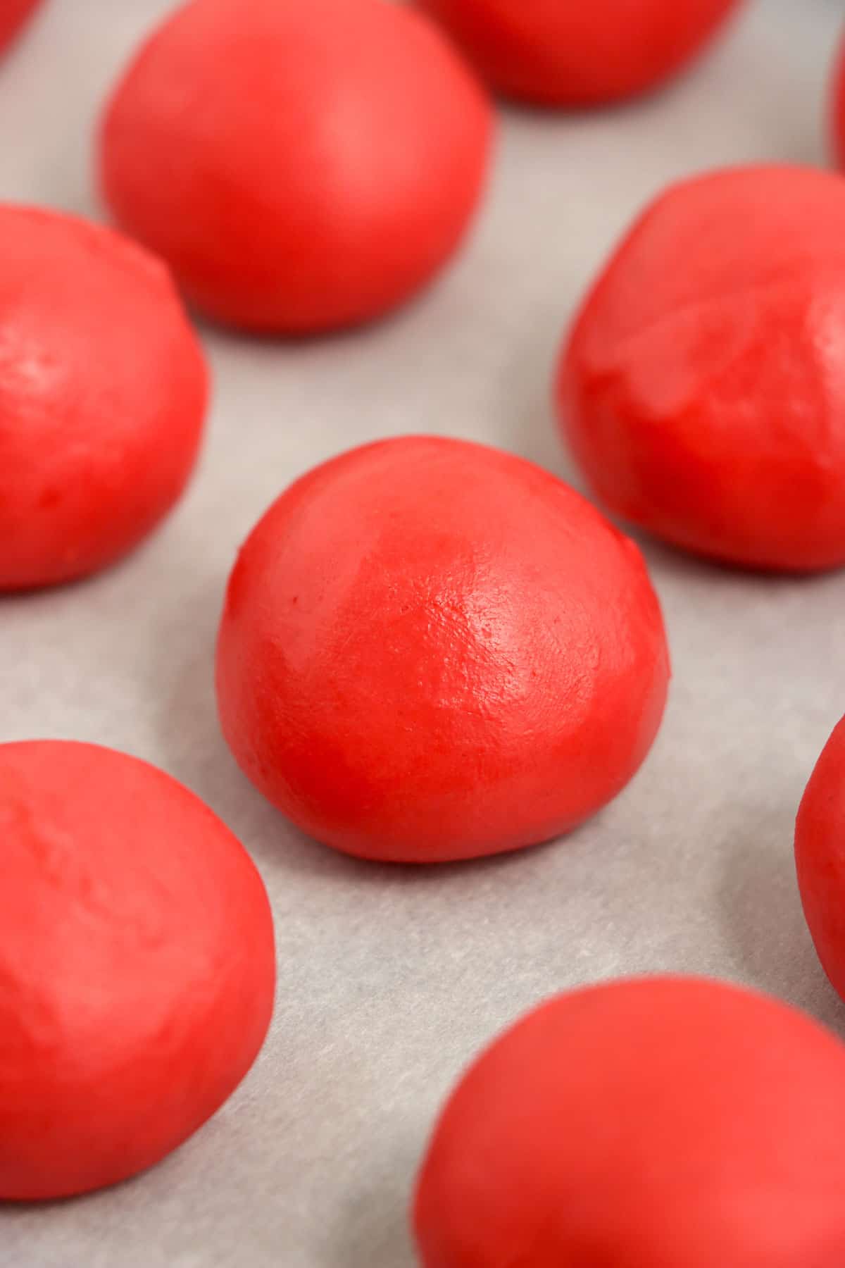 Rolled truffles on a sheet pan.