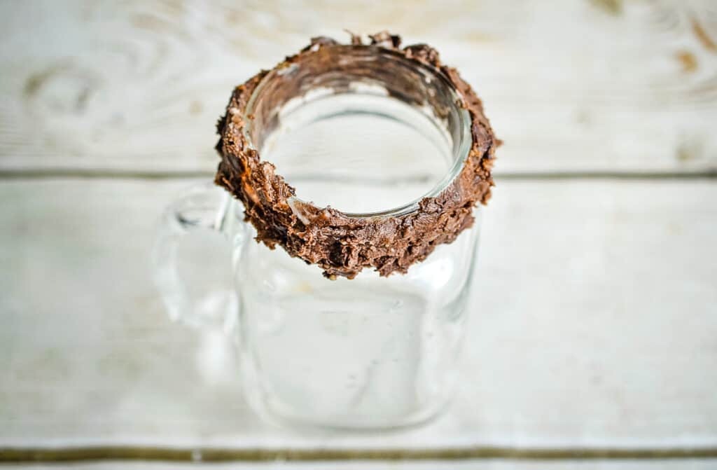 The rim of the glass rolled in icing.