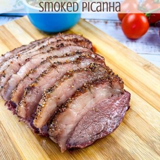 Smoked picanha sliced on a cutting board.