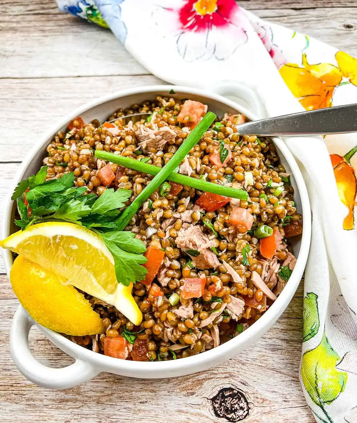 A horizontal image of Wheat Berry Salad with Tuna and Tomatoes.