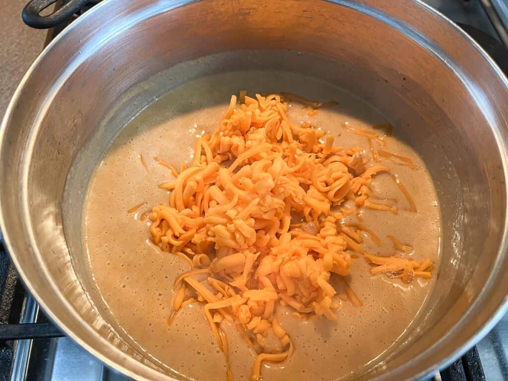 Cheddar cheese added to the sauce.