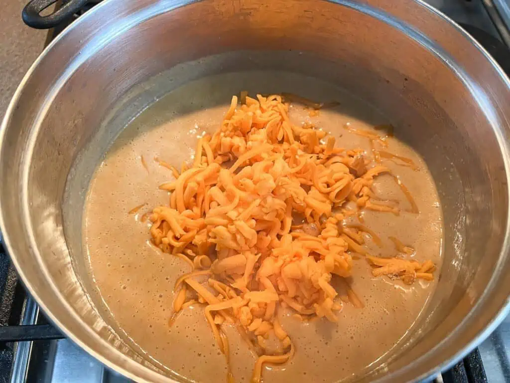 Cheddar cheese added to the sauce.