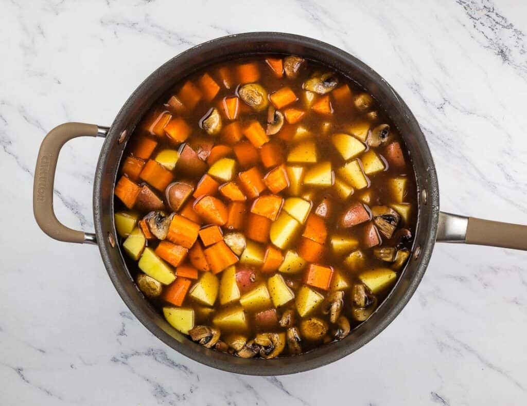 Vegetables simmering in broth.