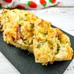 Bacon, Cheddar, Green Onion Scones on a black platter.