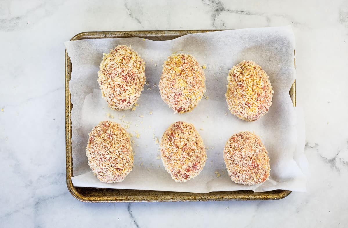 Breaded Scotch Eggs ready for baking.