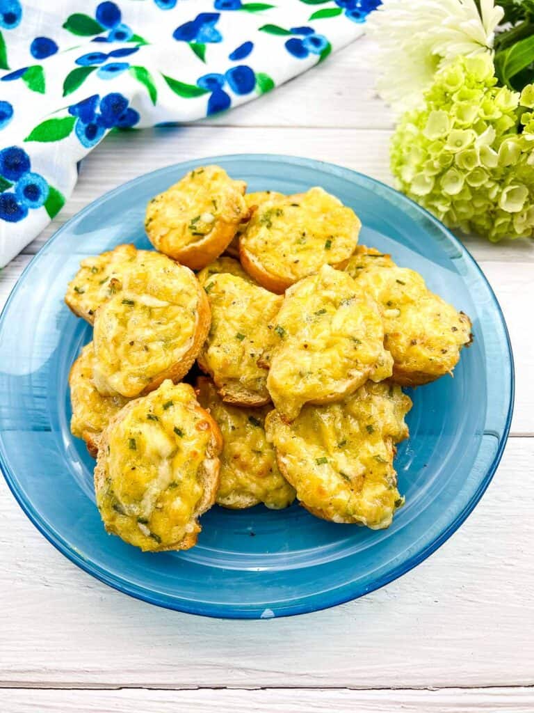 Cheese toasties on a blue plate.