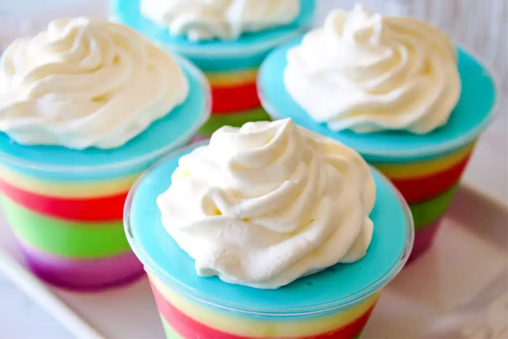 Easter dessert cups topped with whipped cream