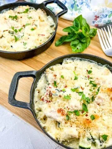 Chicken & Zucchini Casserole in 2 black dishes.