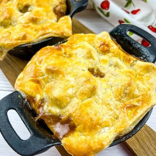 Two Leftover Roast Beef Pot Pies on a board.