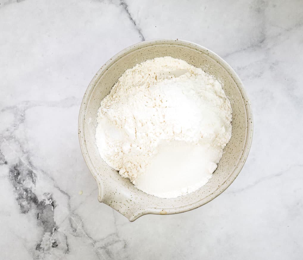 Mixing the dry ingredients in a bowl.