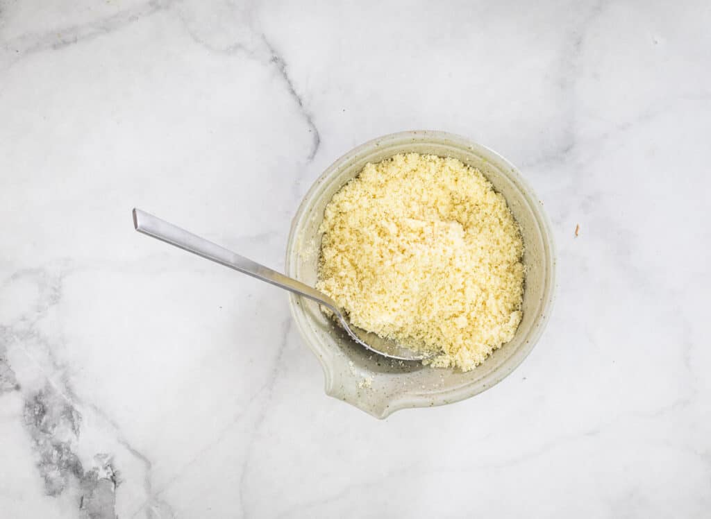 Butter mixed with panko and Parmesan in a bowl.