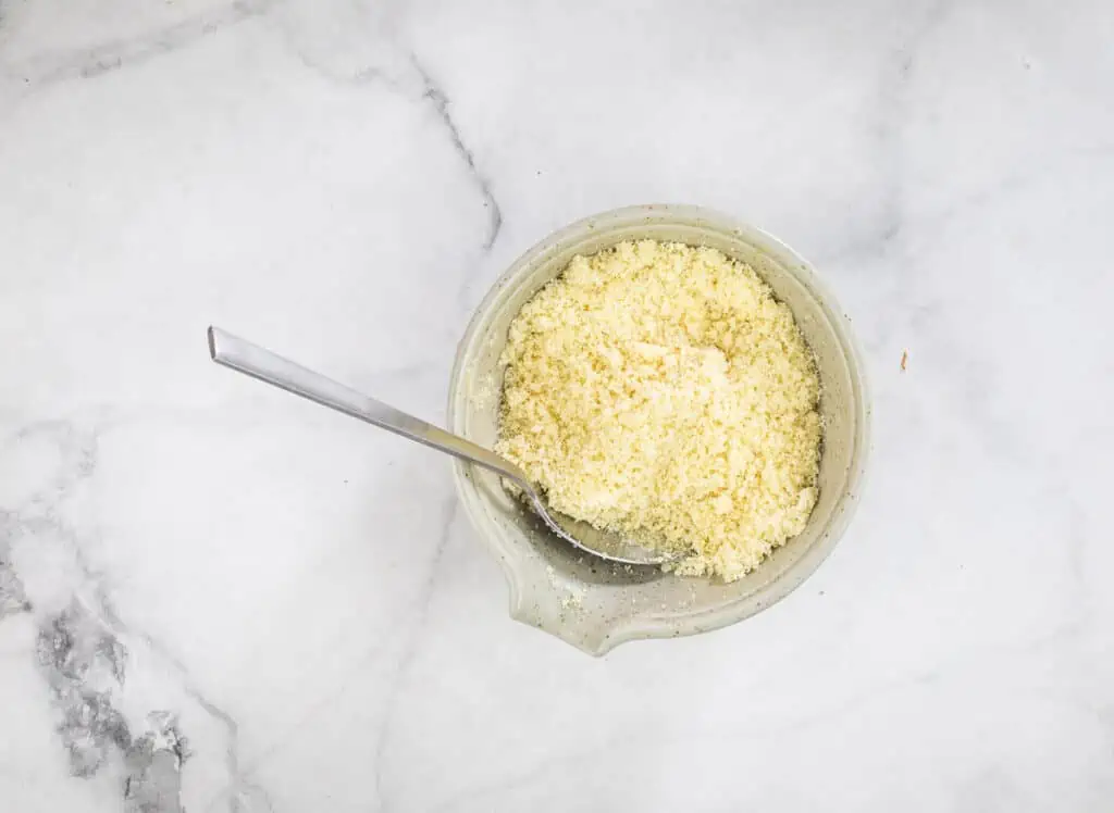 Butter mixed with panko and Parmesan in a bowl.