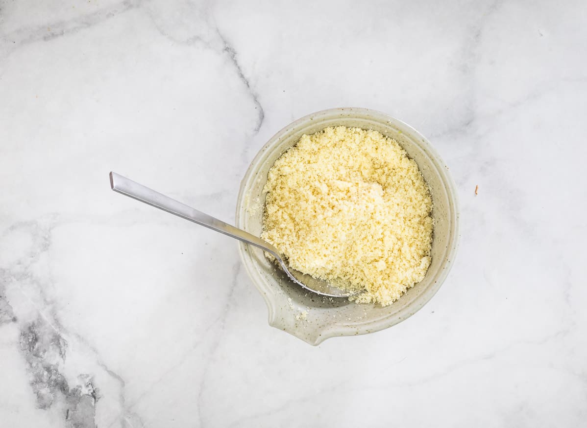 Butter mixed with panko and Parmesan in a bowl.