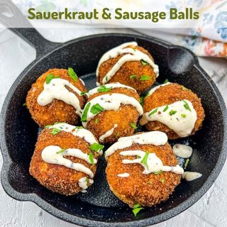Sauerkraut & Sausage balls in a black dish.