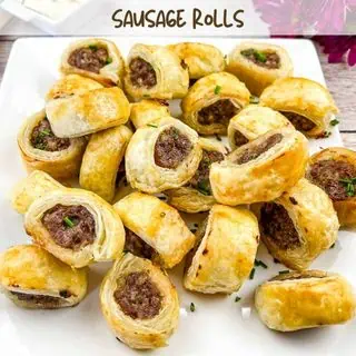 Sausage Rolls on a square plate.