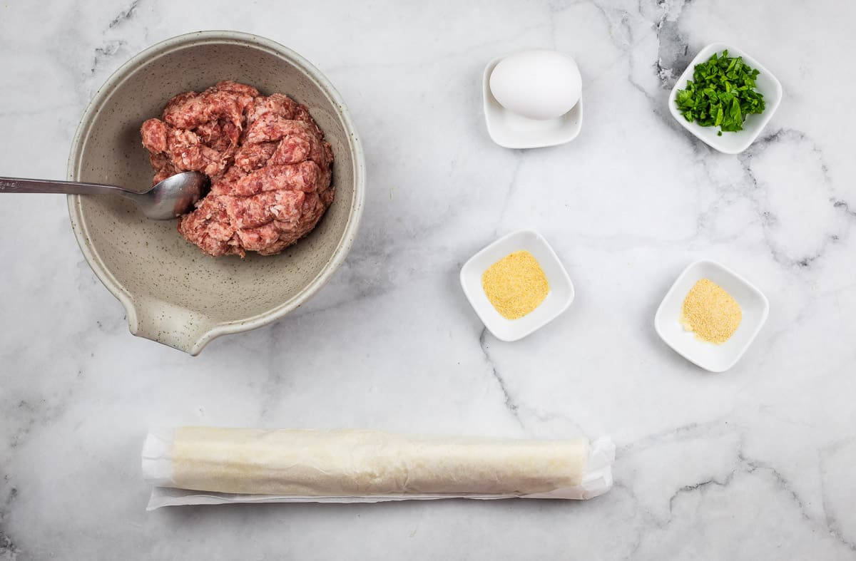 Sausage roll ingredients on a counter.