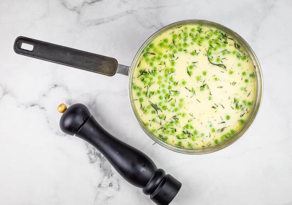 Cream and peas added to the soup.