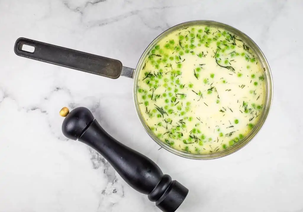 Cream and peas added to the soup.
