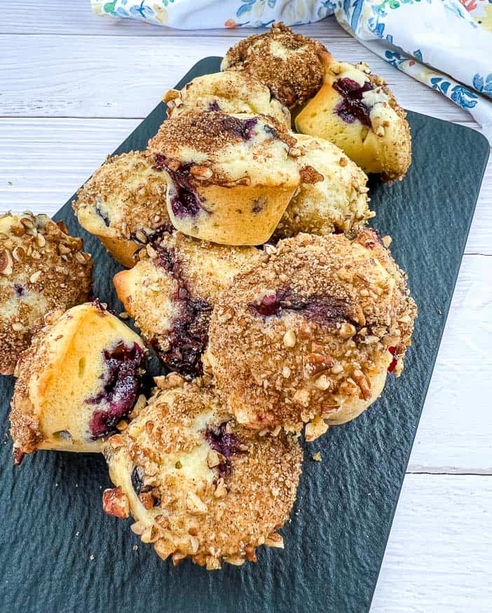 Mini Blueberry Muffins on a black platter.