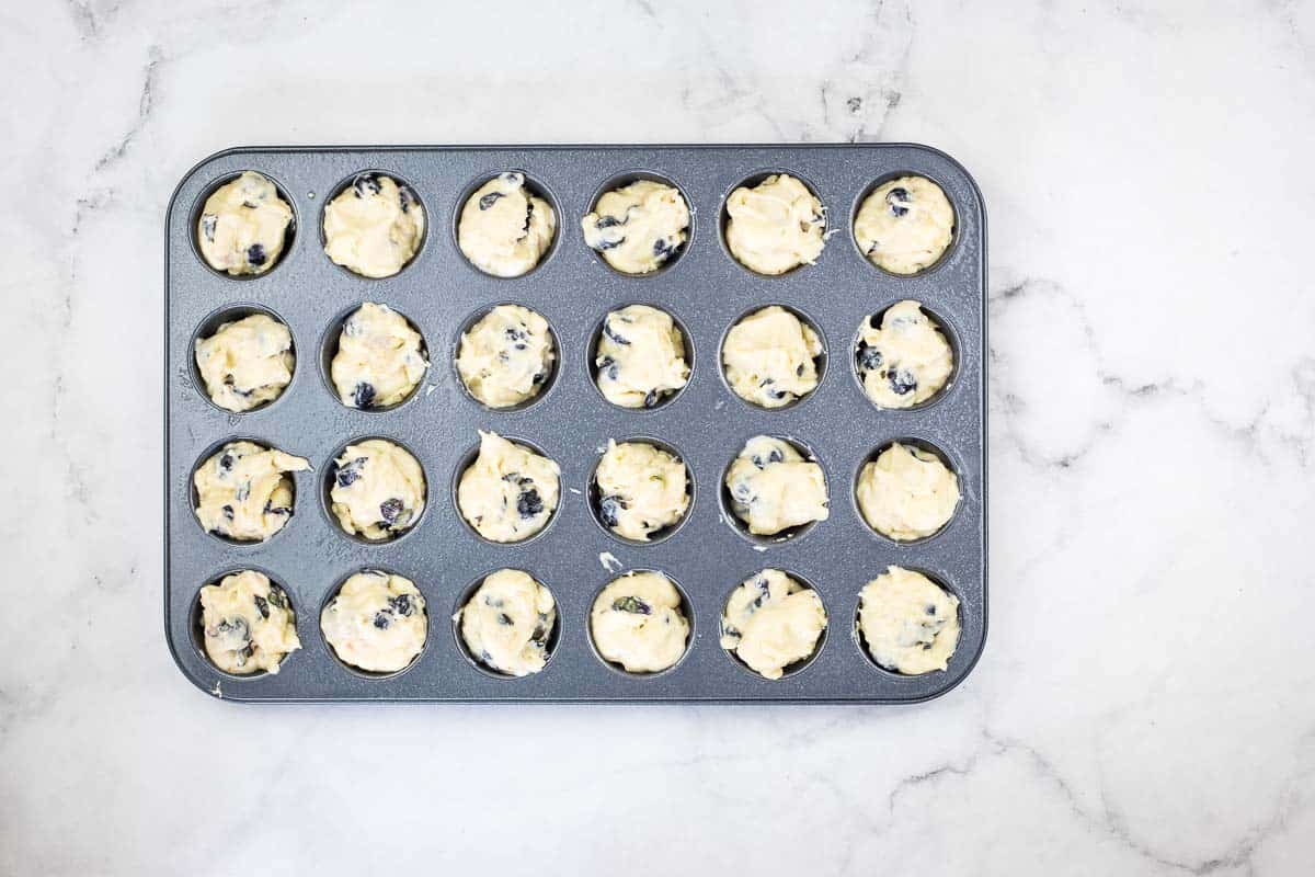 Muffin tin filled with batter.