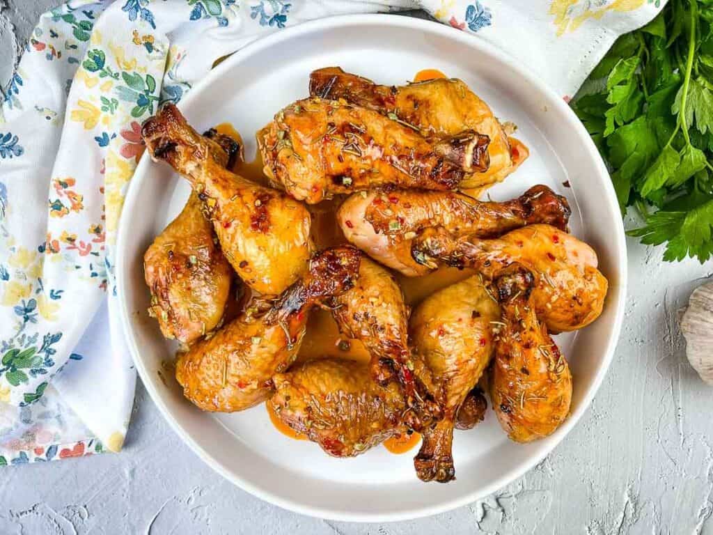 A plate of glazed chicken legs.