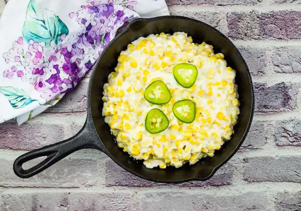 Smoked Creamed Corn in a cast iron skillet.