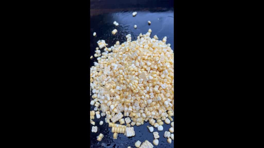 Cooking the corn on a griddle.