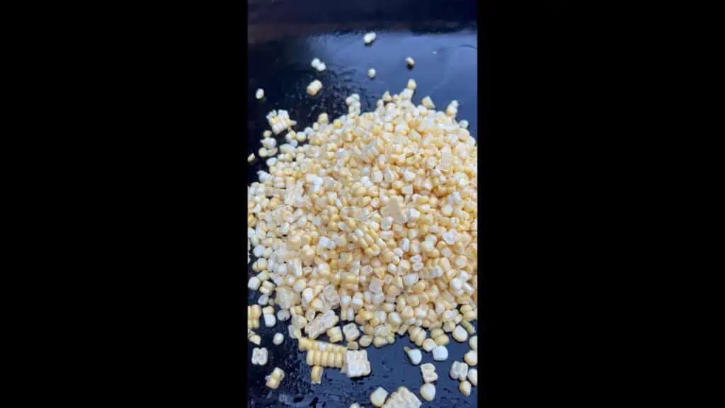 Cooking the corn on a griddle.
