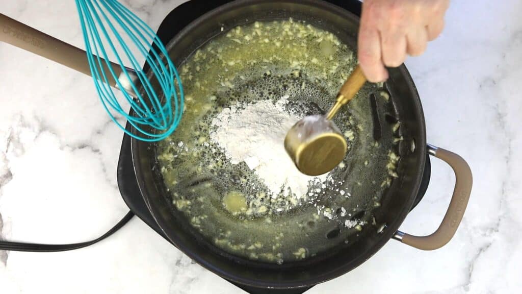 Whisking in the flour.