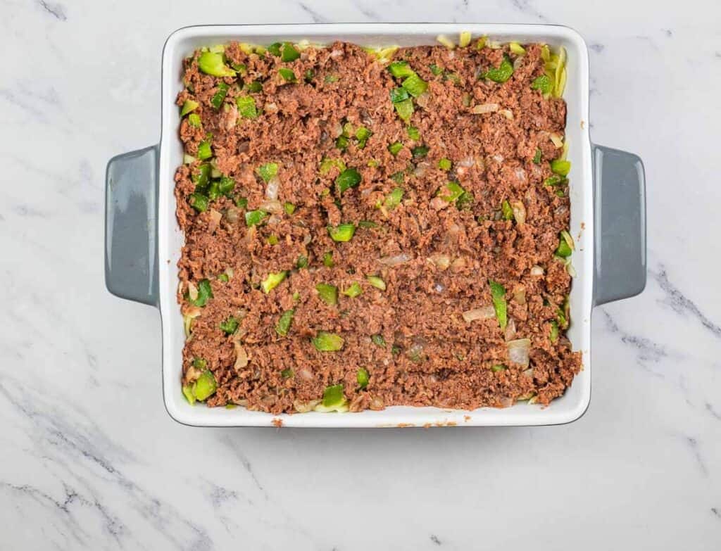 Corned beef mixture on top of the cheese.