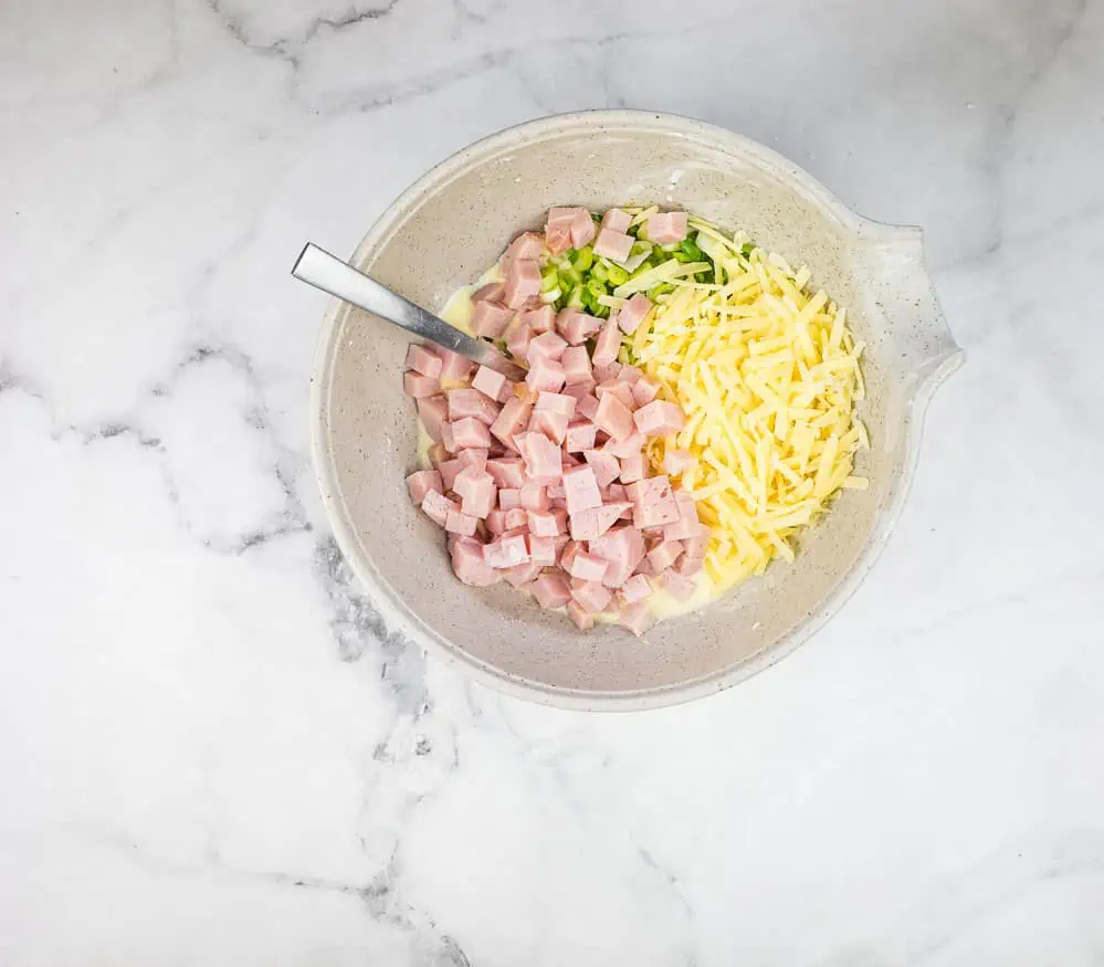 Ham, cheese, and green onions and wet ingredients mixed together.