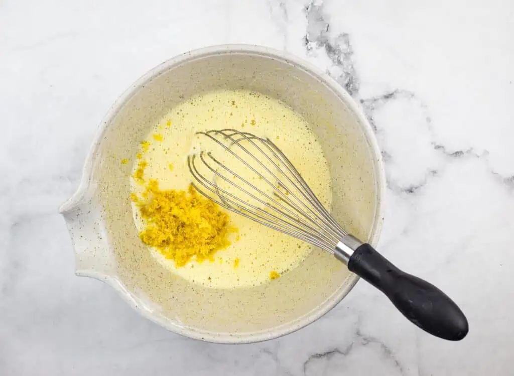 Zest and butter added to egg and sugar mixture.