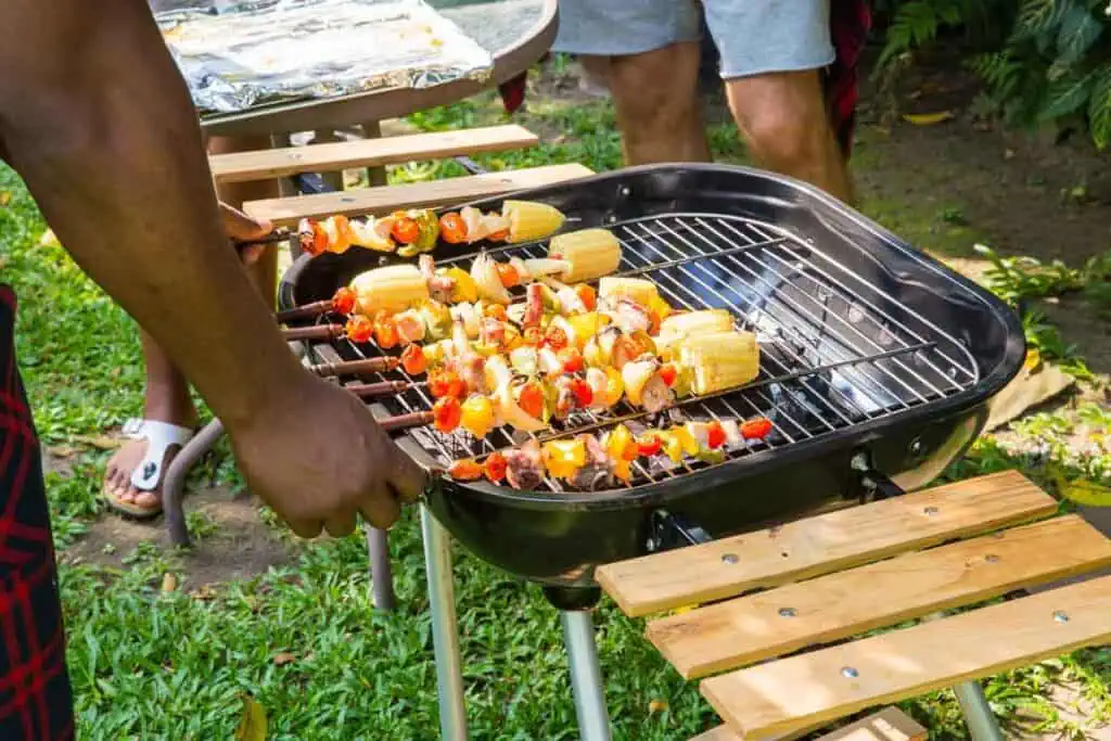 Man cooking meat on the BBQ.