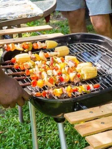 Man cooking meat on the BBQ.