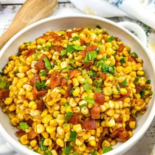 Bacon Fried Corn in a white serving bowl.