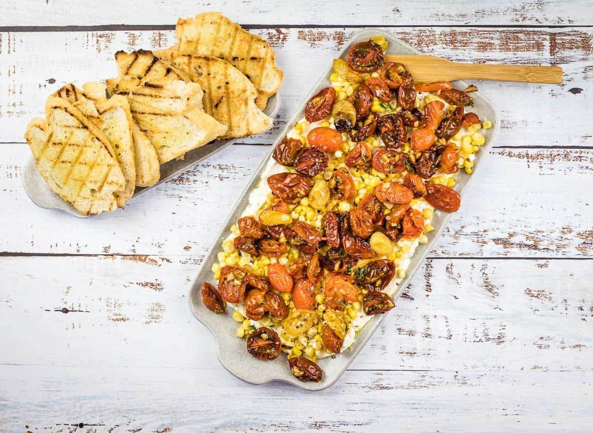 Tomato bruschetta board on a table.