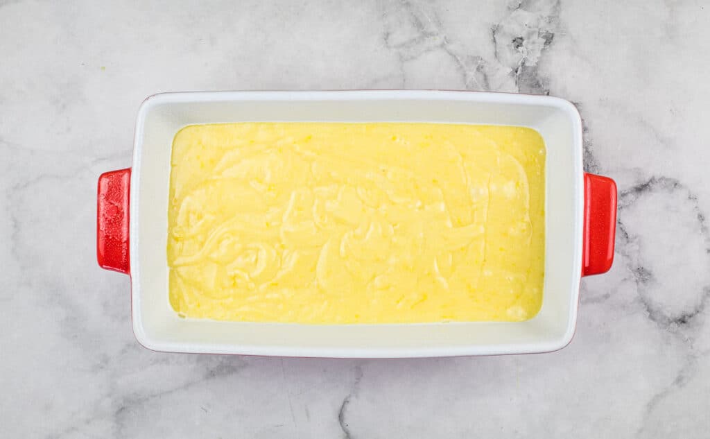Lemon loaf batter in a loaf pan.